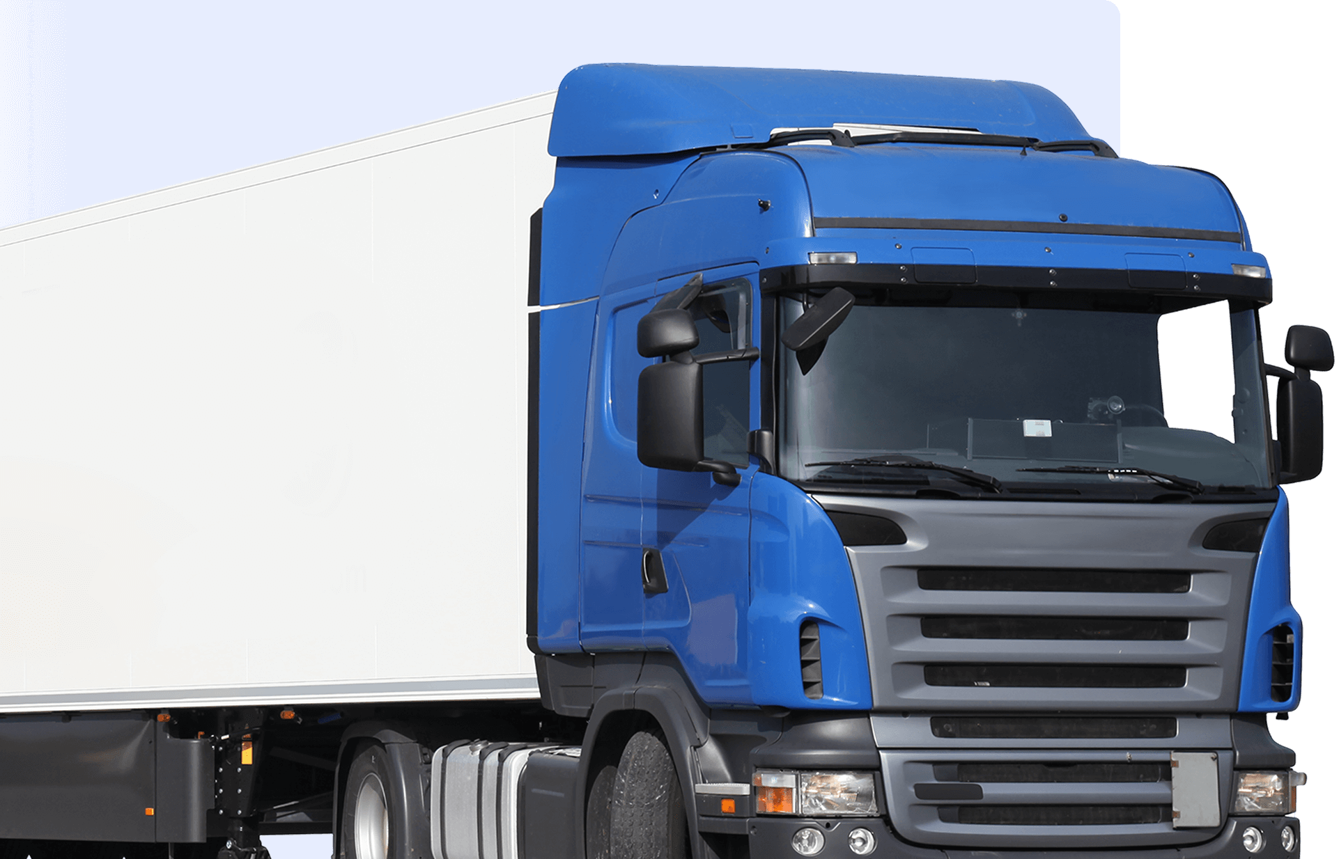 A blue and white semi-truck with a trailer, viewed from the front left angle, against a solid blue background.